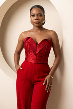 Crimson floral jacquard corset with architectural sweetheart neckline.
